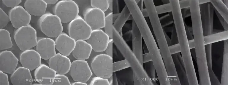 Lyocellvezels onder een rasterelektronenmicroscoop: ronde doorsneden en gladde, rechte oppervlakken